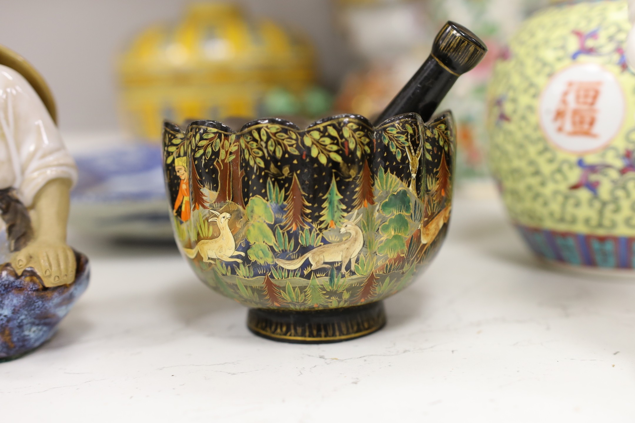 A collection of mostly Chinese ceramics, to include a vase, a lion dog, pestle and mortar etc.